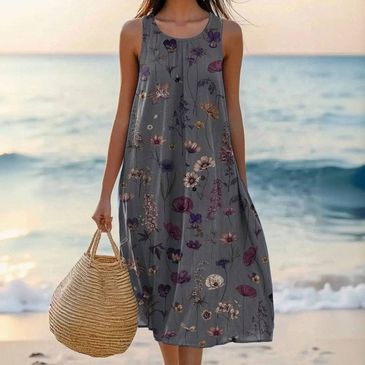 Elegant women's floral midi dress, round neck & sleeveless. Flattering summer style, available in plus sizes.