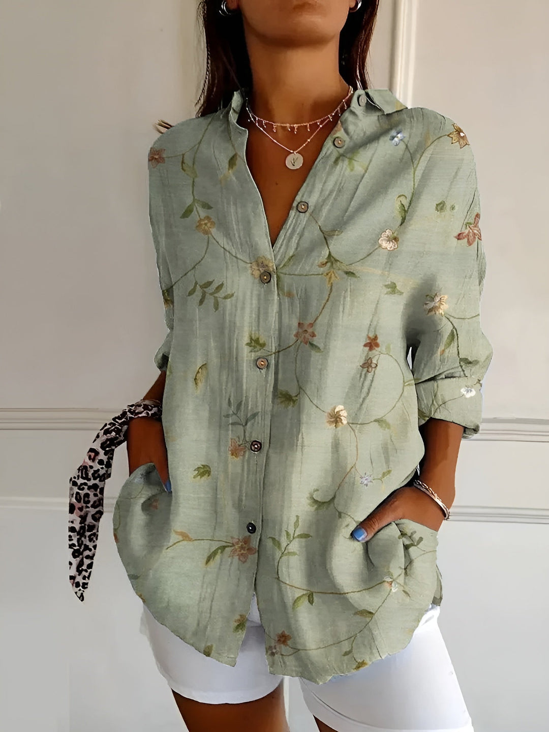 Relaxed fit women's blouse with elegant floral vine print and full button-down front. Summer casual.