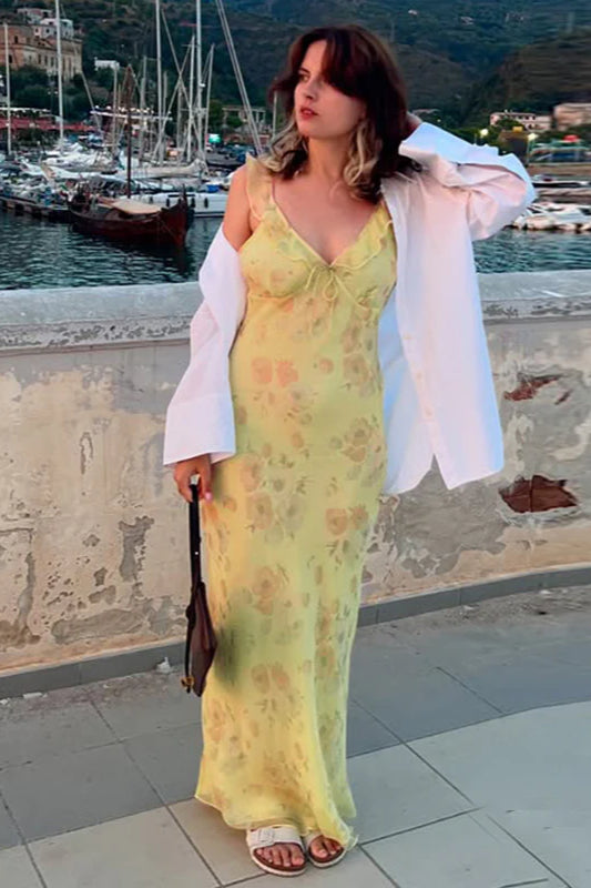 Elegant women's floral spaghetti strap maxi dress. Ideal for summer vacation wear or a stylish beach look.