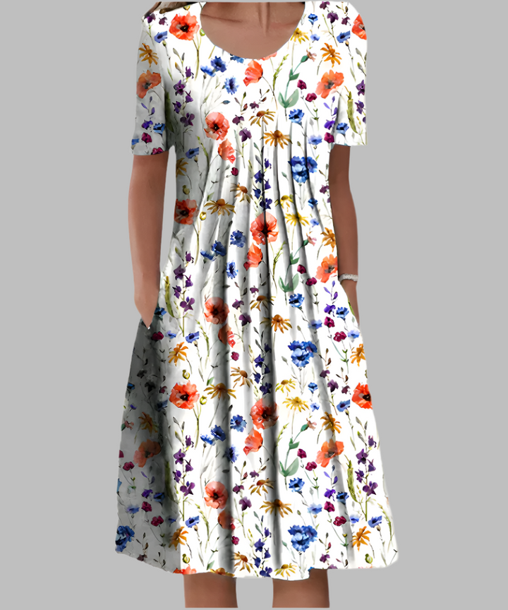 Women's floral printed midi dress with short sleeves, perfect for casual summer wear. Comfortable & elegant.