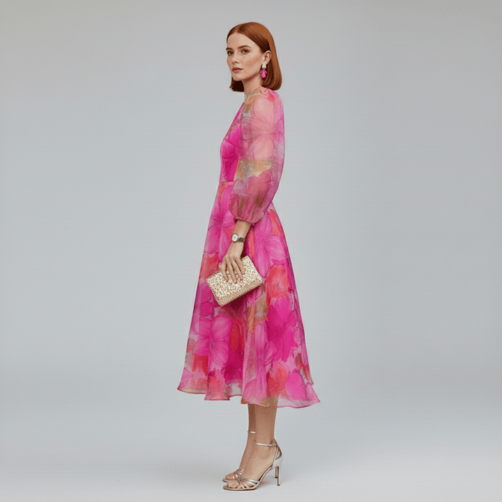 Beautiful floral print A-line midi dress for women. Features stylish puff sleeves, ideal for spring/summer events.