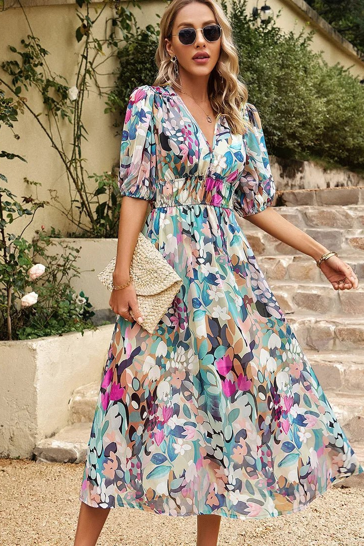 Close-up of elegant puff sleeves on a women's floral midi dress. Stylish for summer casual or party wear.