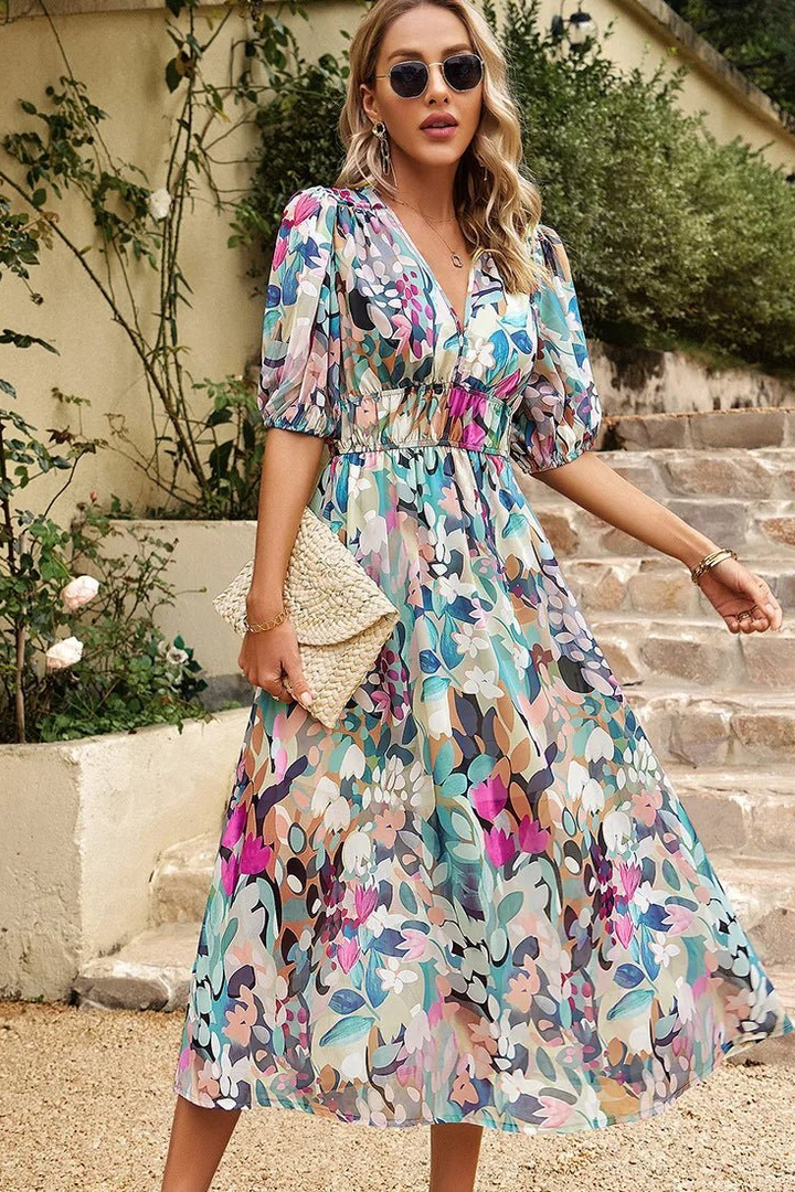 Close-up of elegant puff sleeves on a women's floral midi dress. Stylish for summer casual or party wear.