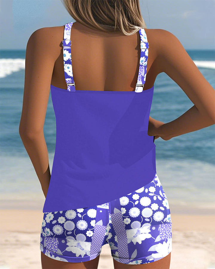 Modest women's floral print racerback tankini and boyshorts, ideal for beach or pool days.
