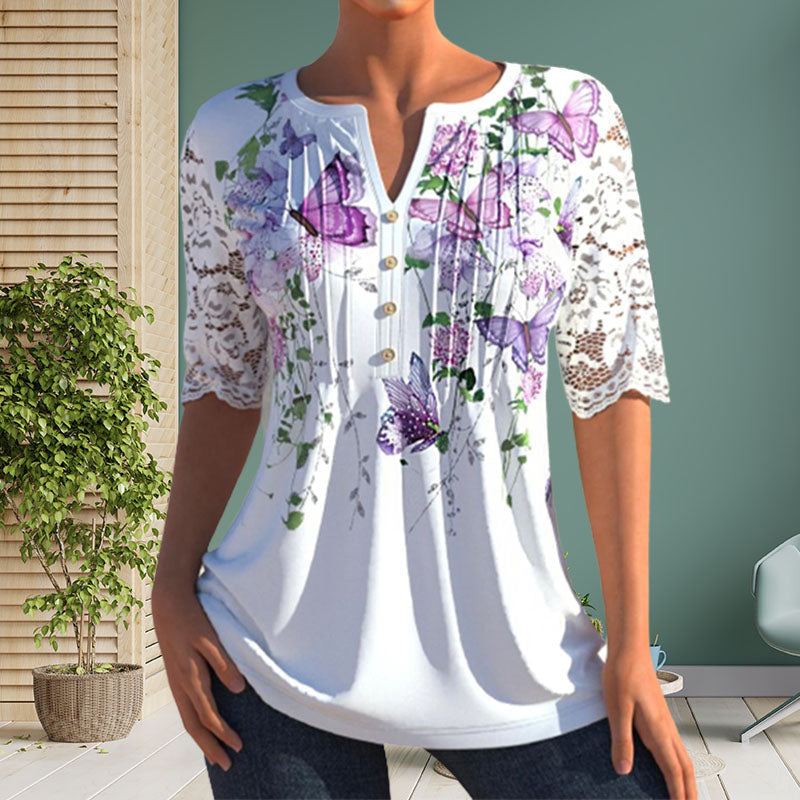 Close-up of a polyester women's blouse featuring a vibrant floral print and button details