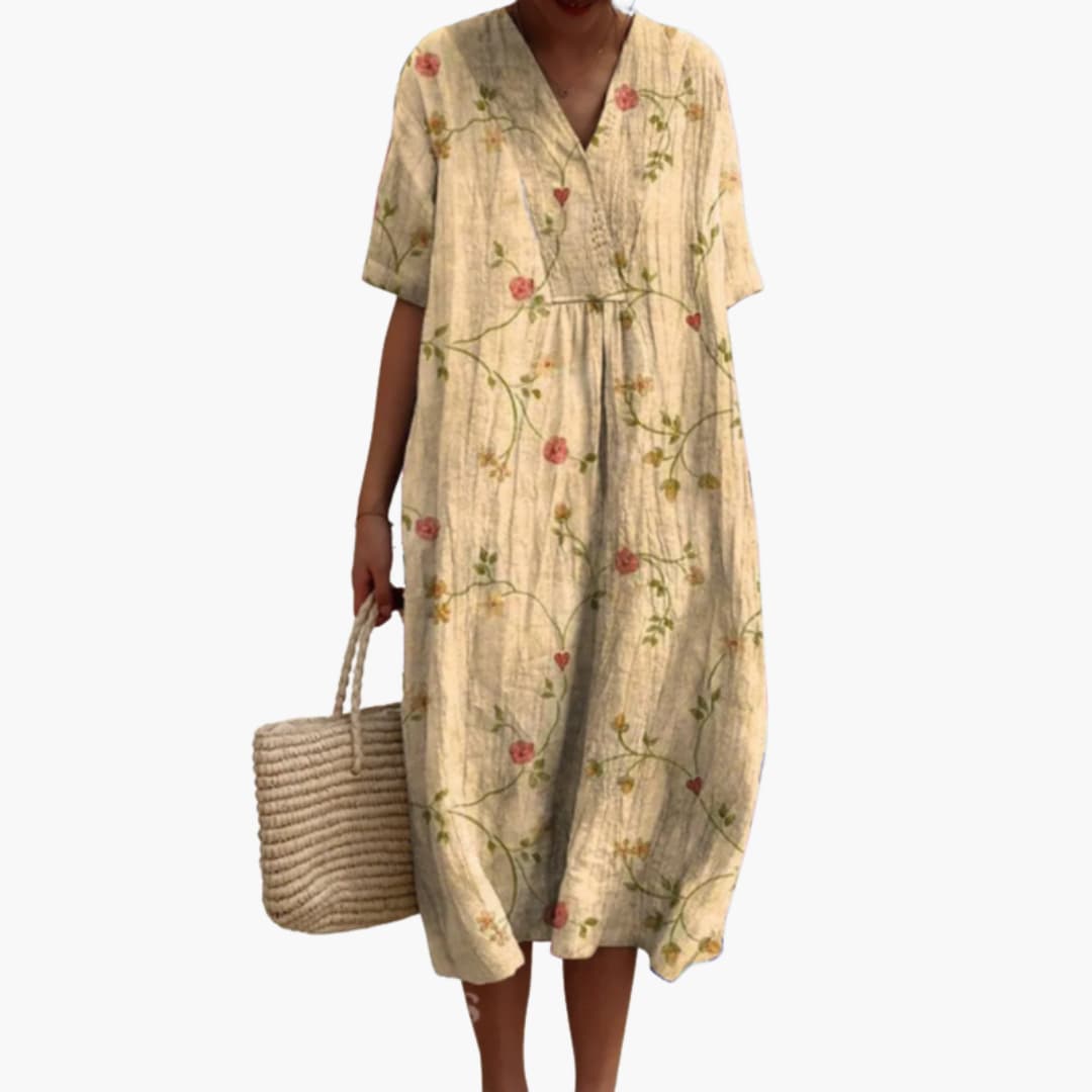 Elegant floral midi dress for women, V-neck, short sleeve, oversized, suitable for casual summer events.