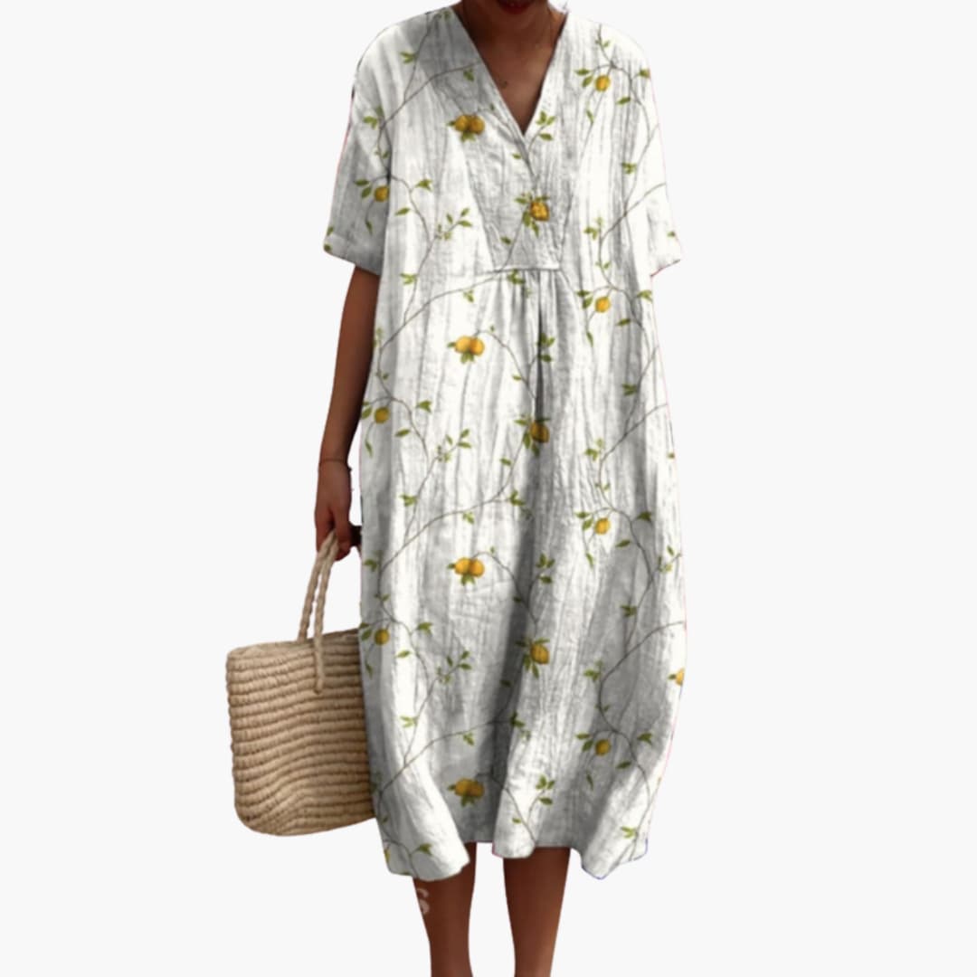 Loose fit floral V-neck midi dress for women, short sleeve, oversized casual style, great for warm summer days.