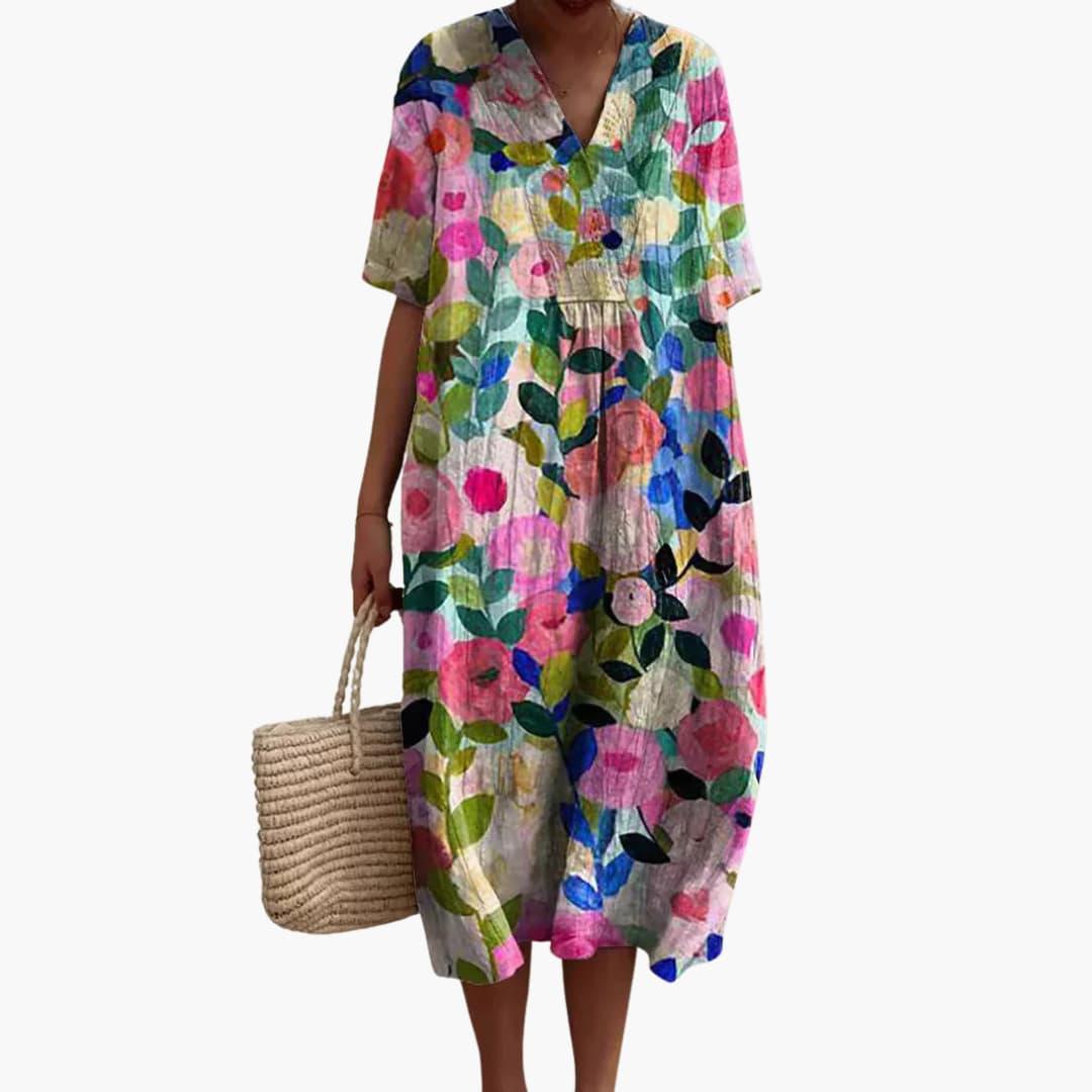 Oversized V-neck short sleeve women's midi dress with vibrant floral pattern, great for casual summer style.