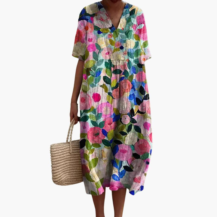 Oversized V-neck short sleeve women's midi dress with vibrant floral pattern, great for casual summer style.