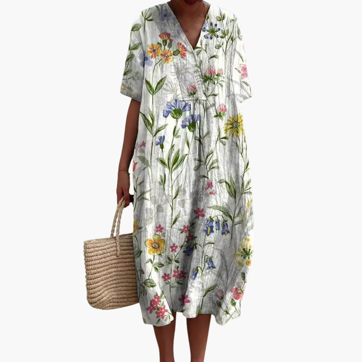Comfortable oversized floral midi dress for women, V-neck, short sleeve, relaxed fit, ideal for summer.