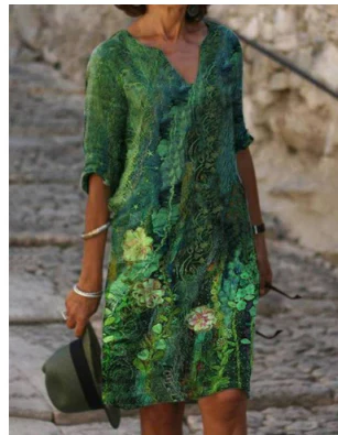 Women's floral V-neck midi dress with artistic face print, perfect for summer casual wear