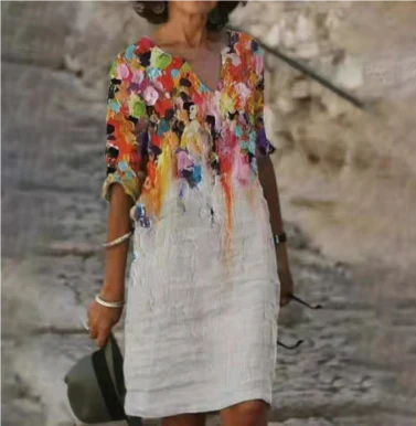 Fashionable women's summer dress, midi length, floral and artistic face print, v-neck style