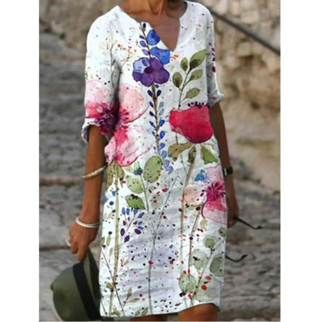 Stylish women's casual midi dress with a beautiful blend of floral and artistic face prints
