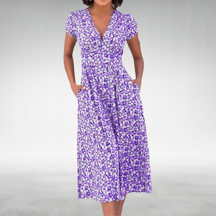 Casual women's midi dress in a vibrant floral print, styled with a sophisticated V-neck and pockets.