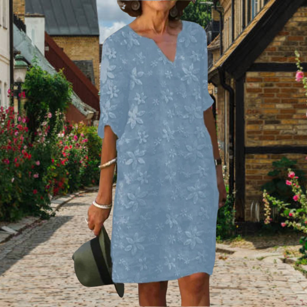 Stylish women's floral print V-neck midi dress with pockets, a perfect summer shift dress.