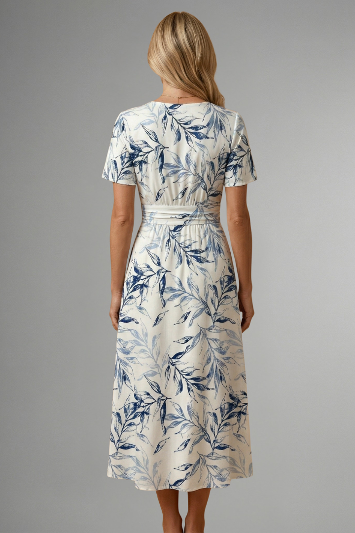 Printed women's floral A-line midi dress with a V-neck, featuring short sleeves for effortless spring-summer style.