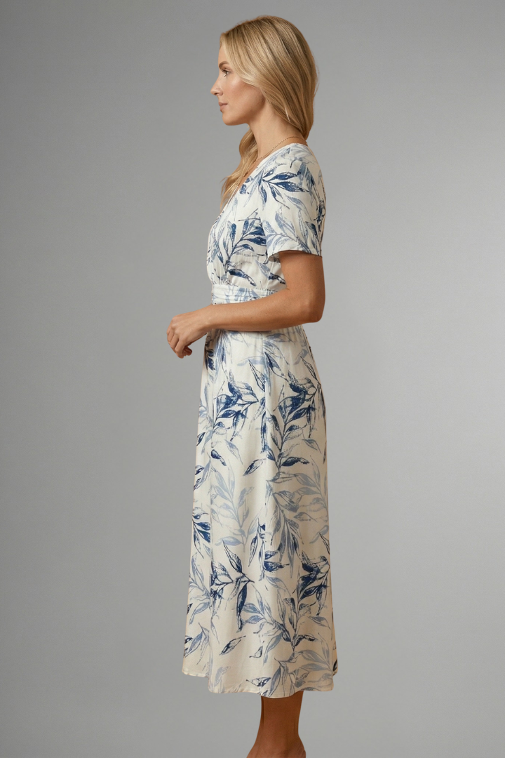 Chic women's floral print midi dress, V-neck, short sleeve, flattering A-line cut, ideal for vibrant spring fashion.