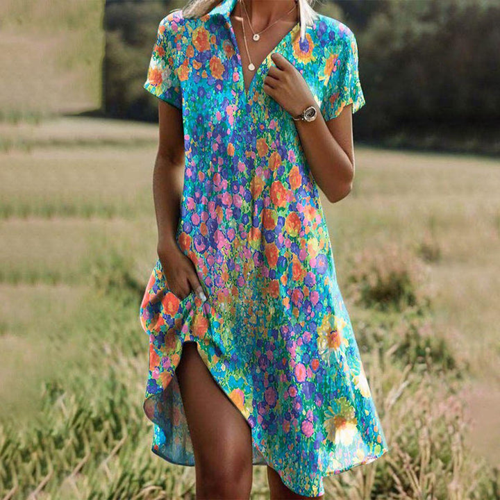 Women's floral V-neck midi summer dress with short sleeves for a relaxed, stylish look. Perfect casual vacation outfit.