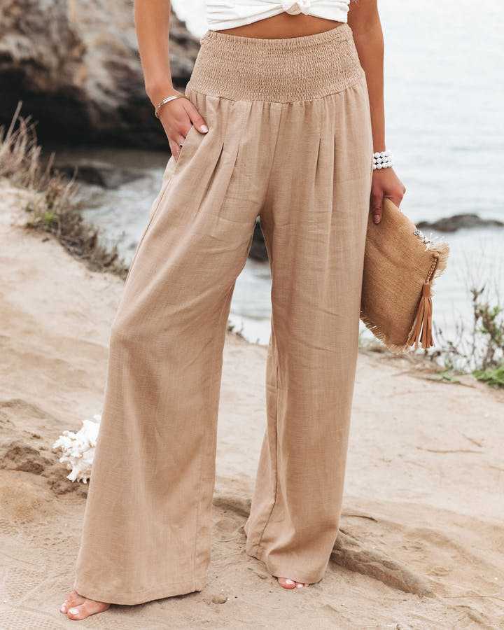 Women's flowing wide leg beach trousers, perfect for summer casual wear & resort vacations. Comfortable & stylish.