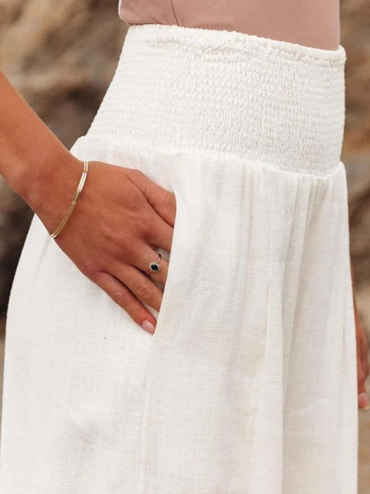 Lightweight women's flowy wide leg trousers, perfect for a breezy summer beach look or relaxed vacation resort wear.