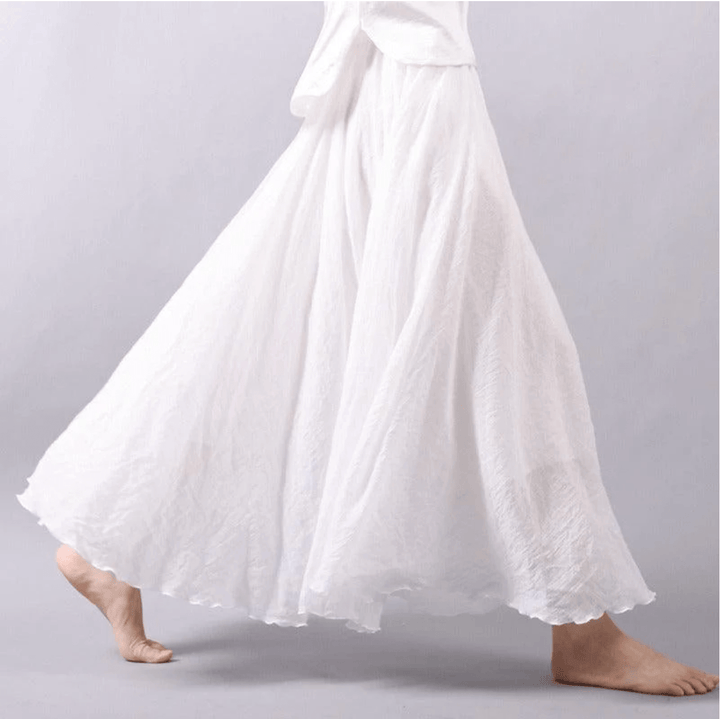 Women's flowy A-line maxi skirt, perfect for bohemian beach days or elegant summer resort wear.
