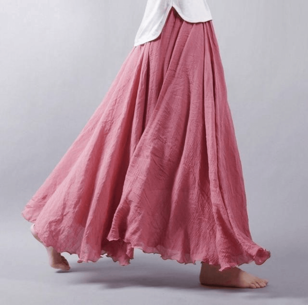 Elegant women's flowy maxi skirt with a chic A-line cut, perfect for resort wear or stylish summer fashion.