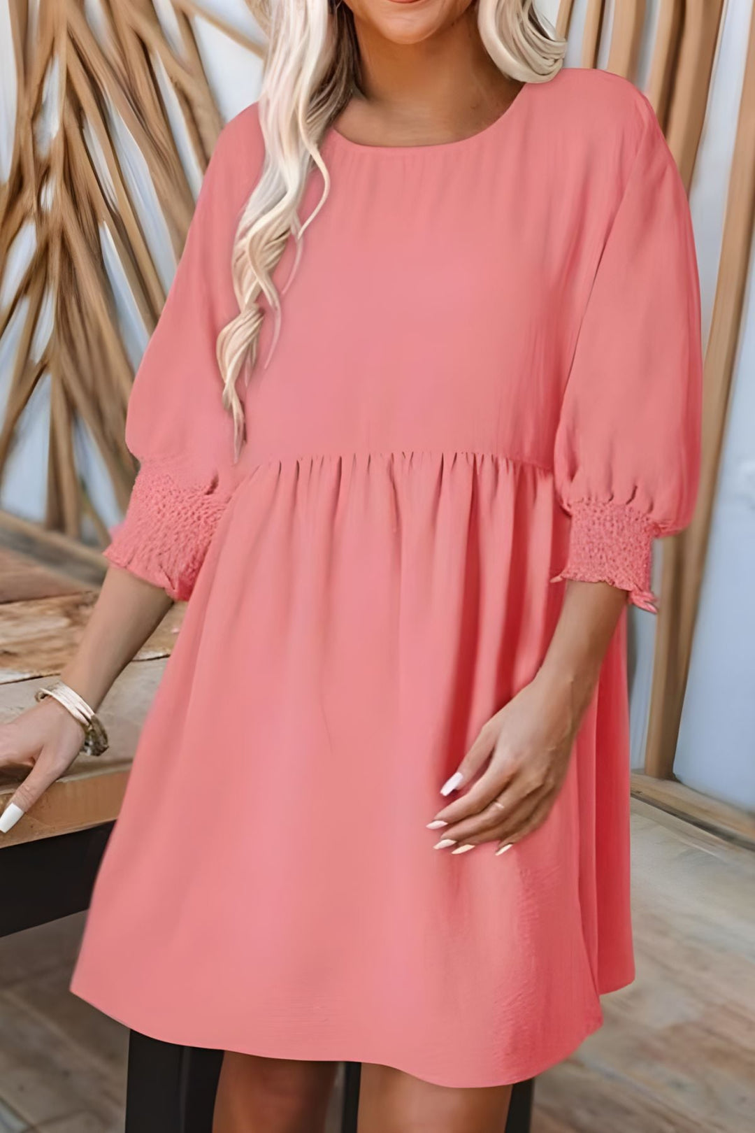 Stylish casual women's mini dress. Flowy babydoll design with smocked cuffs, great for any sunny day.
