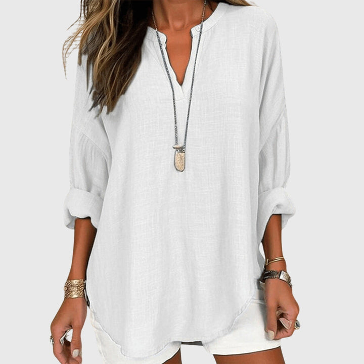 Chic women's long sleeve beach shirt, a flowy elegant top ideal for resort wear & summer fashion.