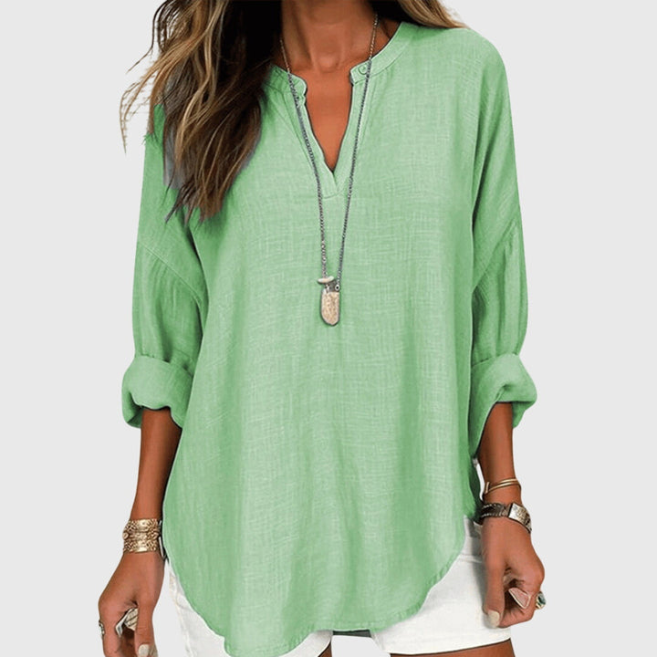 Elegant women's long sleeve flowy shirt, a loose fit beachwear top for stylish summer vacation outfits.