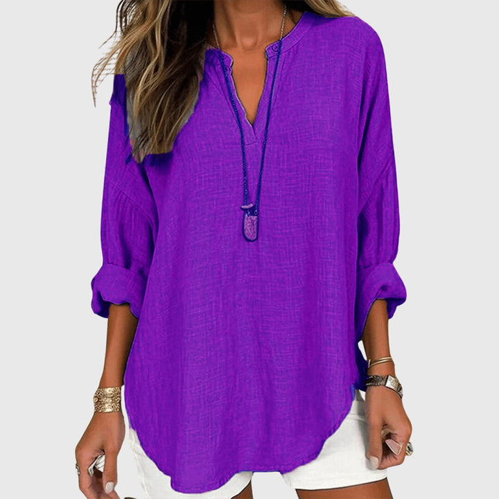 Elegant women's flowy long sleeve shirt, perfect beachwear for chic summer fashion and vacation outfits.