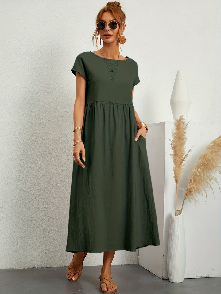 Women's flowy maxi dress, loose fit with round neck & short sleeves. Casual chic design includes practical pockets.