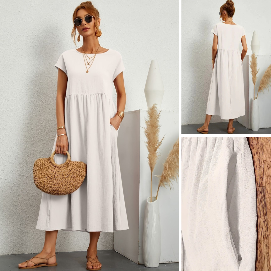 Chic women's flowy maxi dress with pockets, featuring a flattering round neck & short sleeves for casual style.