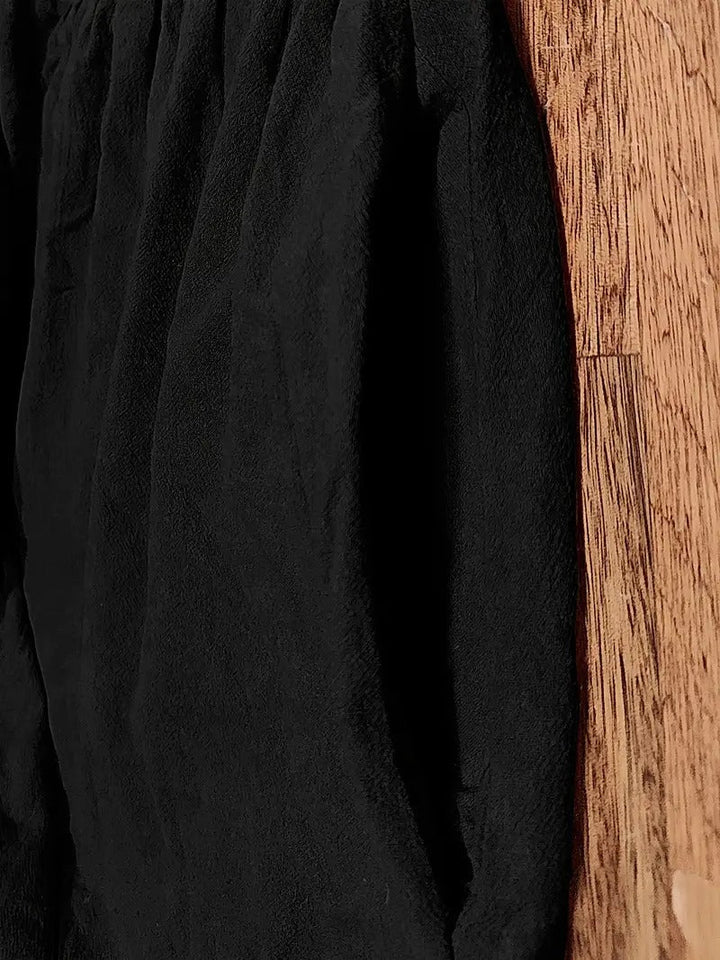 Detail shot of convenient side pockets on a women's loose fit flowy maxi dress, perfect for everyday wear.