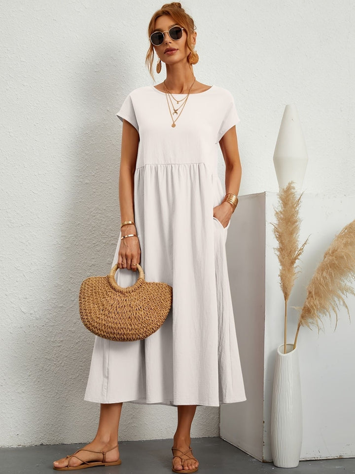 Close-up of soft fabric texture on a women's comfortable flowy maxi dress, designed for summer everyday wear.