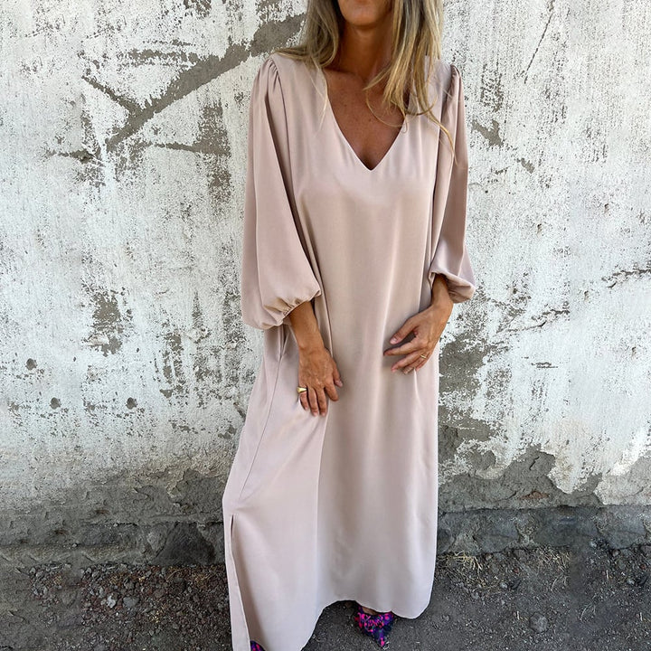 Comfortable women's flowy maxi dress with balloon sleeves and pockets, great for casual summer or spring days.