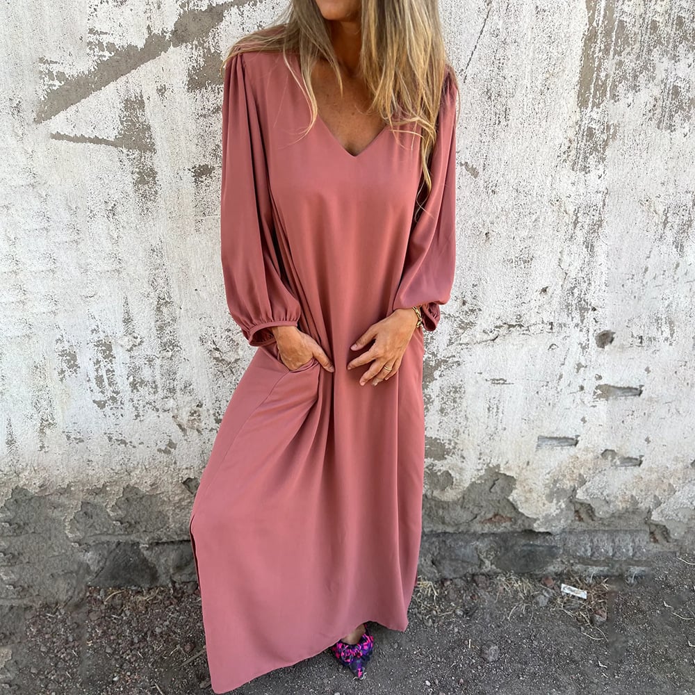 V-neck flowy maxi dress for women featuring chic balloon sleeves and convenient side pockets. Versatile and stylish.