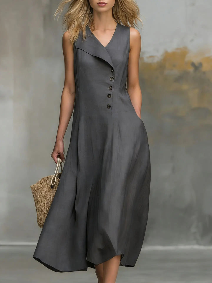 Close-up of the elegant button detail and soft flowy fabric on a women's casual midi summer dress.
