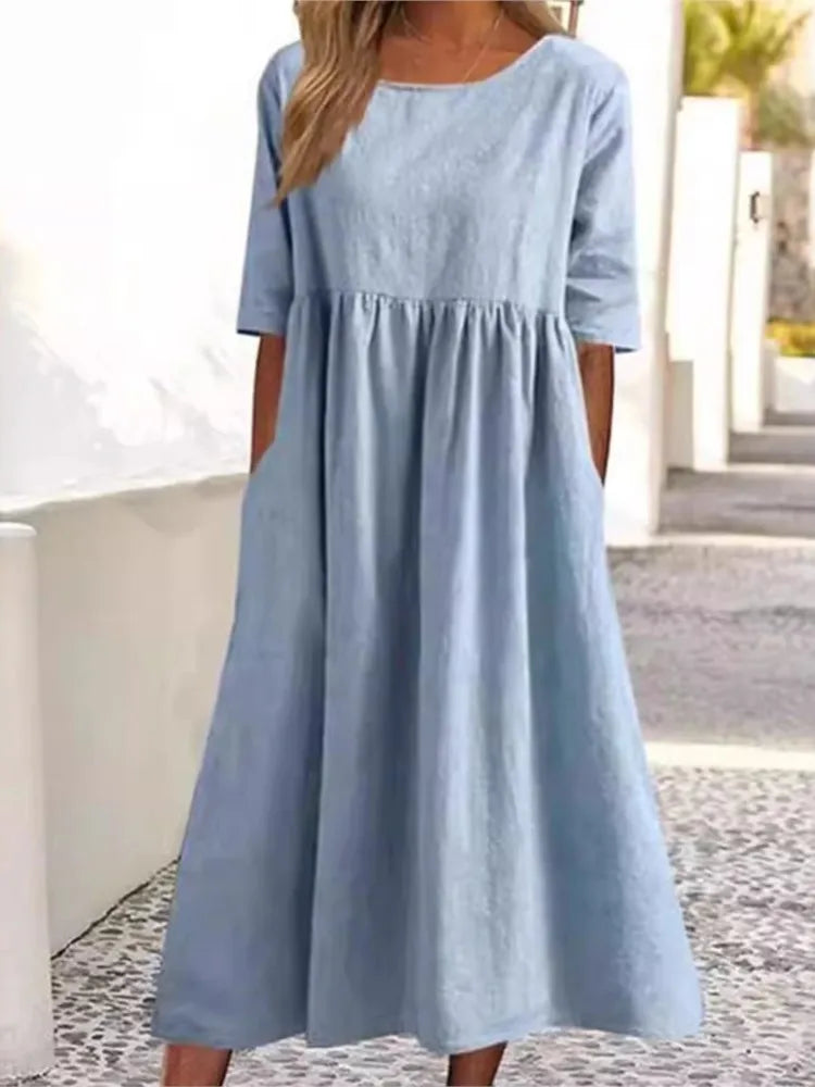Versatile women's flowy midi dress, short sleeve & round neck for comfortable, stylish everyday wear.