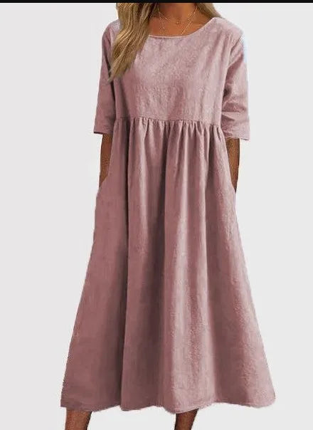 A-line flowy midi dress for women, with a chic round neck and short sleeves, perfect for comfort.