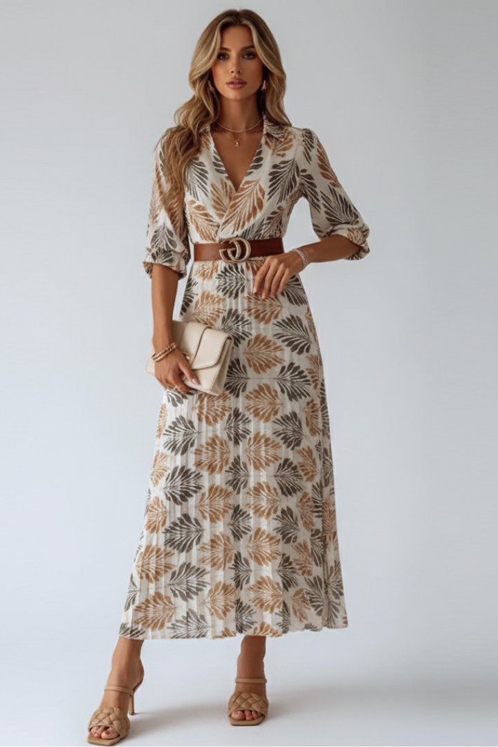 Chic women's patterned maxi dress, long and flowy, featuring comfortable elbow sleeves for spring fashion.