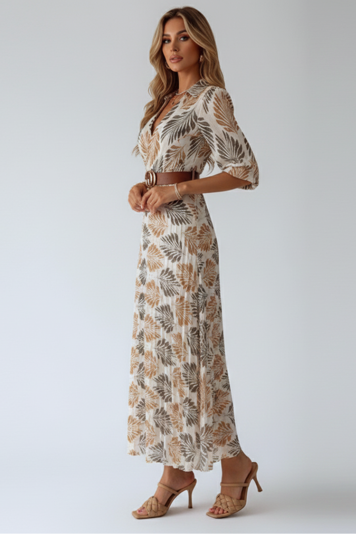 Elegant women's patterned maxi dress, full-length with practical elbow sleeves, ideal for warm weather.