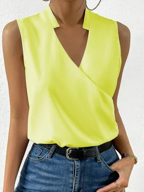 Relaxed fit women's sleeveless V-neck wrap top, a chic flowy design for summer fashion and everyday wear.