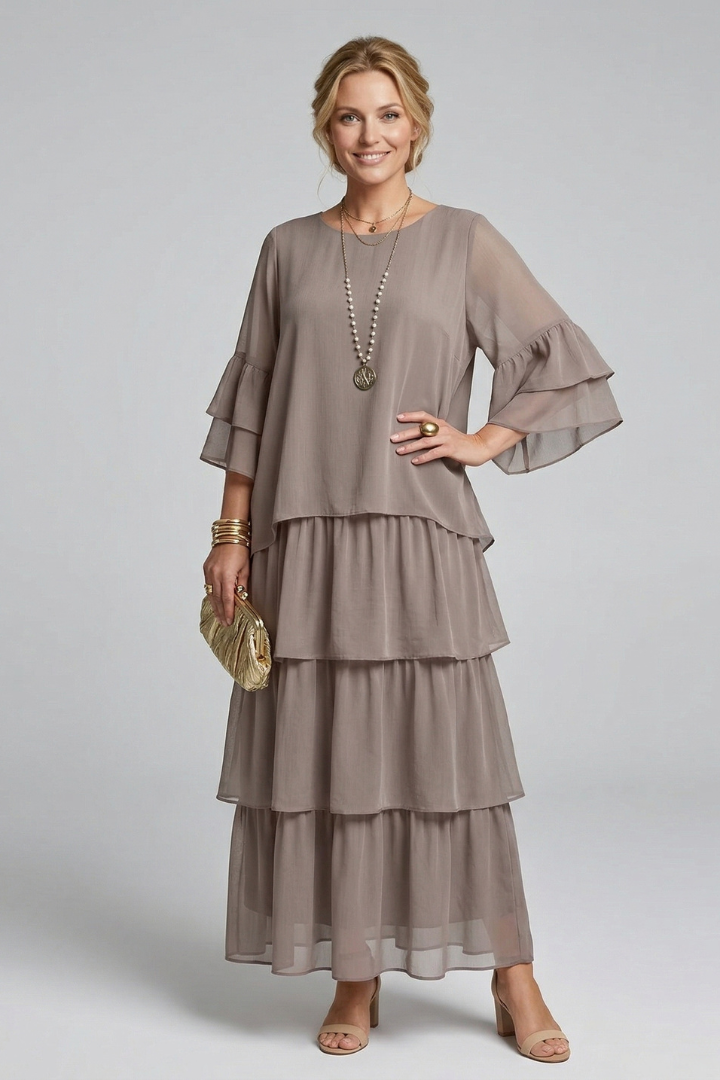 Women's elegant flowy maxi dress, featuring a tiered skirt, round neck, and comfortable relaxed fit.