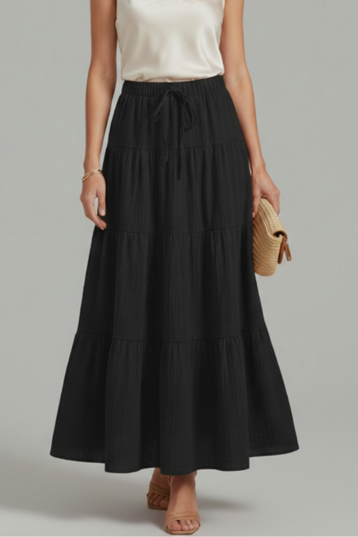 Easy pull-on women's long tiered maxi skirt. Comfy elastic waist ensures a flowy, elegant style for any occasion.