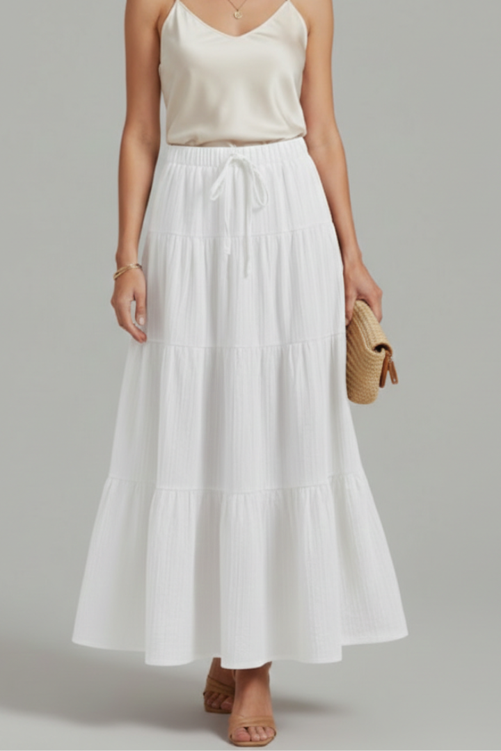Versatile women's flowy tiered maxi skirt, ideal for summer casual wear or elegant styles. Comfortable elastic waist.