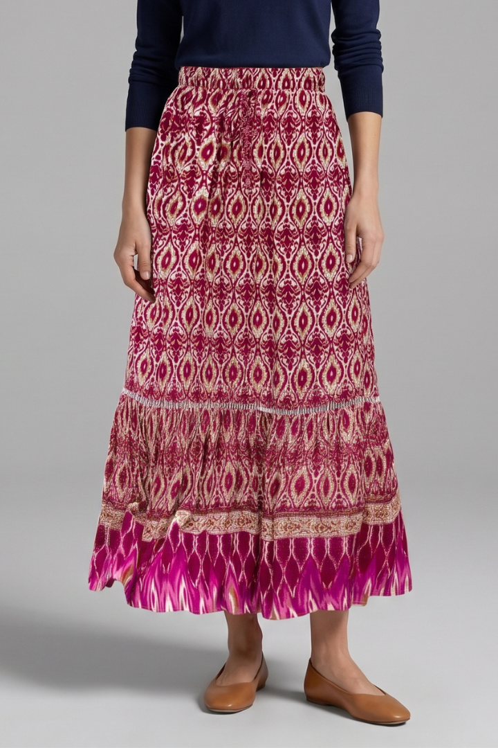 Casual & elegant women's flowy tiered maxi skirt. Long with a comfy elastic waist, perfect for summer fashion.