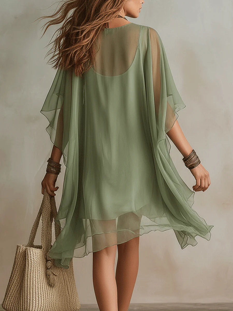 Chic women's V-neck mini dress with flowy layered skirt, ideal as a casual summer or beach dress.