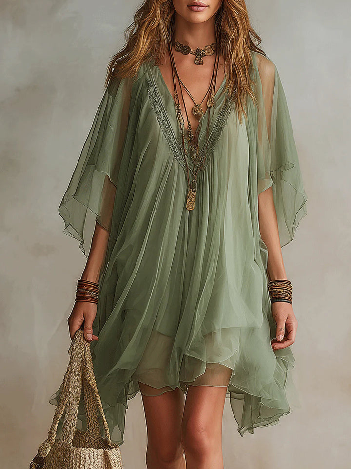 Effortless women's flowy V-neck mini dress. Tiered design for a relaxed, chic summer and beach look.