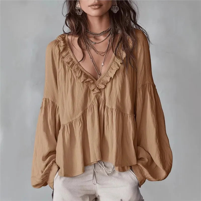Women's flowy V-neck ruffle blouse with puff sleeves, perfect for a chic casual spring or summer look.