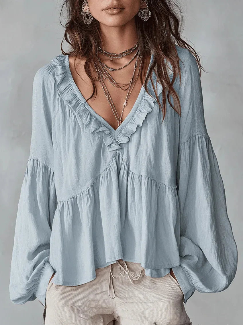 Elegant women's loose-fit ruffle blouse with a V-neck, comfortable for effortless summer and spring fashion.